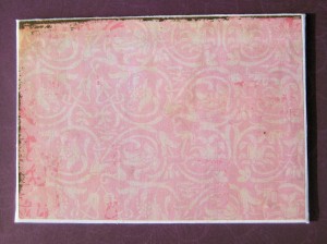 covering canvas board edges with pink pastel crayons
