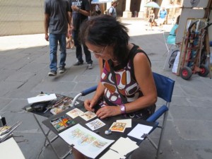 Street artists in Florence, outside the Uffizi Gallery