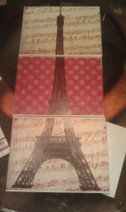 Scrapbooking papers, canvas and an Eiffel tower decal were used to create this amazing piece.