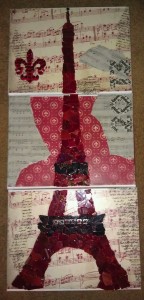 Scrapbooking papers, canvas and an Eiffel tower decal were used to create this amazing piece.