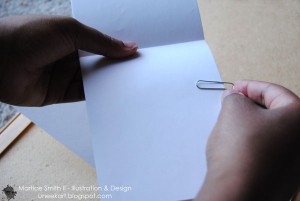 Keep drawing papers in place with paper clips