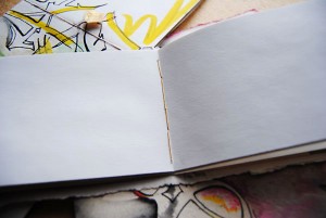 Opened view of sketchbook, showing thread