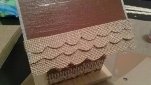 adding scalloped burlap strips to roof