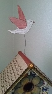 glue the wire on the bird and birdhouse