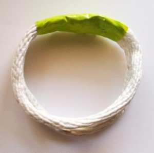Taped lengths of rope form the core of the bangle.