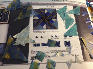 Quilt pattern created in deli paper and encaustic by Vicki Ross