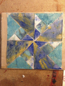 Quilt pattern created in deli paper and encaustic by Vicki Ross