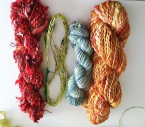 Several kinds of textured, embellished yarns
