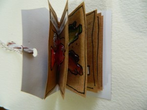 Making little story books from paper tags.